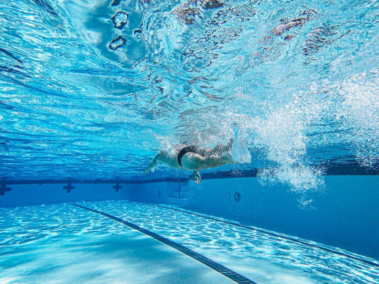 an athlete swimming on the pool